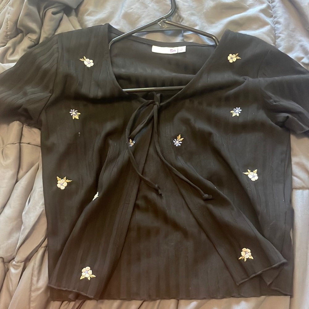 Tie top. Black with white and purple flower detail.